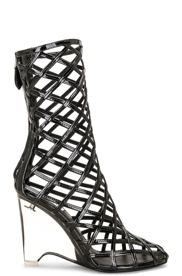 ALAÏA Wedge Boot in Noir - Black. Size 36 (also in ).