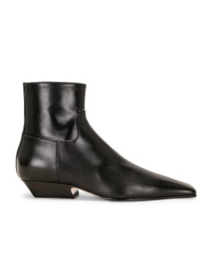 KHAITE Marfa Classic Flat Ankle Boot in Black - Black. Size 36.5 (also in 37, 38.5, 41).