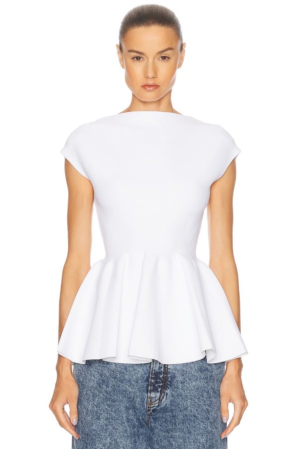ALAÏA Peplum Top in Blanc - White. Size 38 (also in 40).