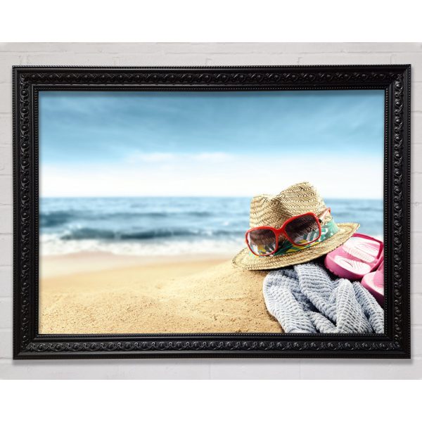 Sun Hat And Sunglasses On The Beach Framed Print