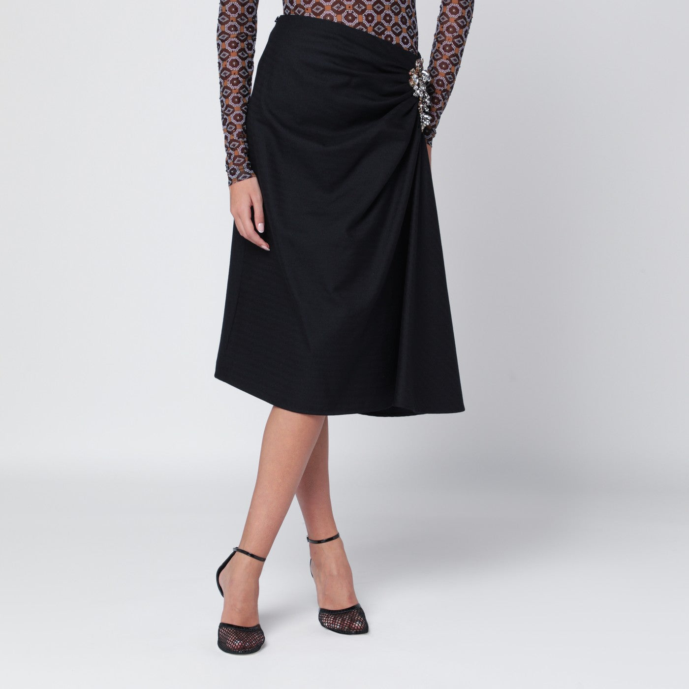 Navy blue draped skirt with brooch